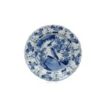 A blue and white 'kraak' porcelain dish with a scalloped rim, decorated with birds on a rock and