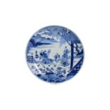 A blue and white porcelain plate decorated with a scene of the 'Romance of the Western Chamber', a