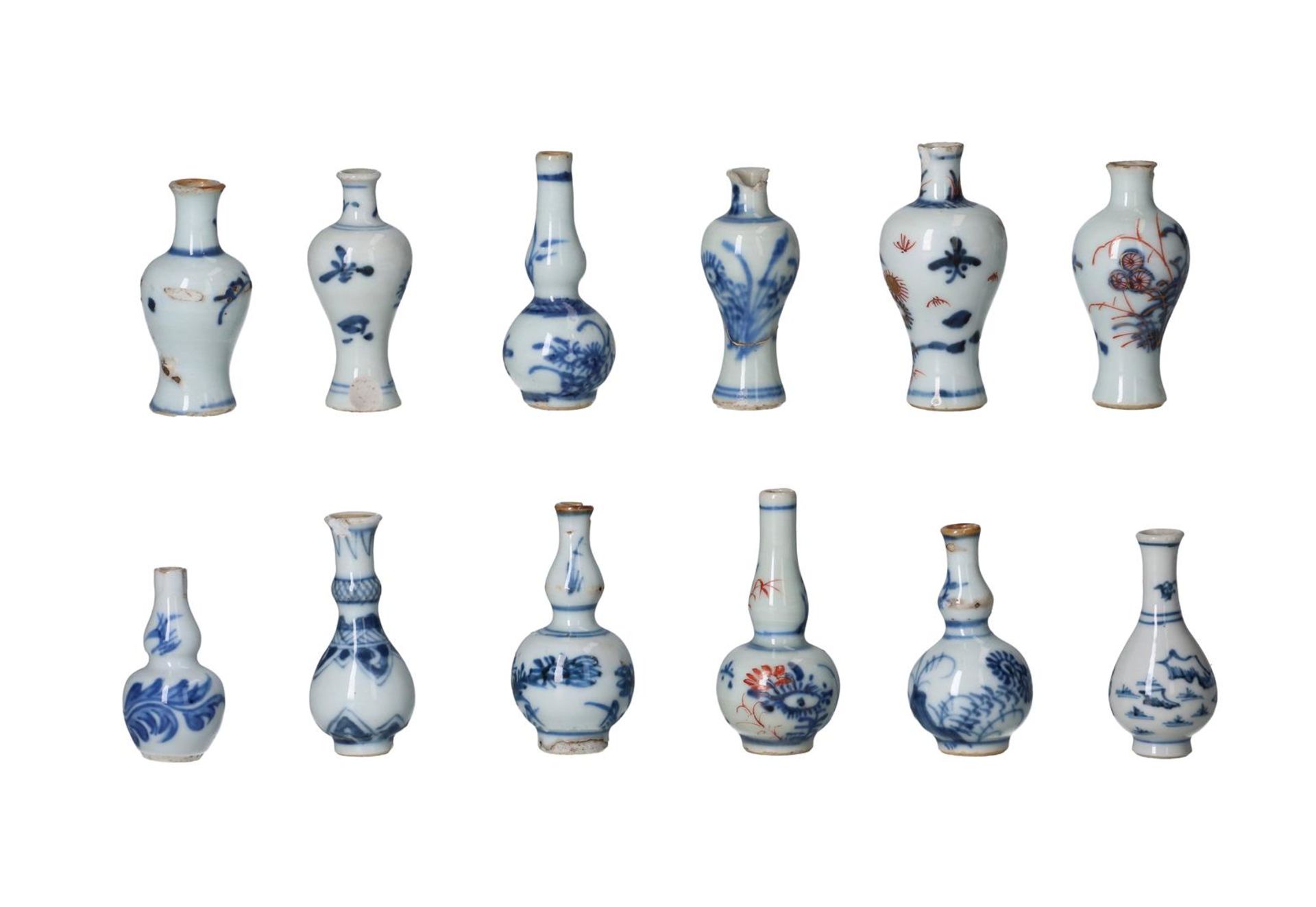 Lot of twelve blue and white Imari porcelain miniature vases, decorated with flowers. Unmarked.