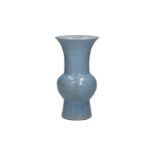 A clair de lune porcelain yen yen vase with a floral decoration in relief. Marked with 6-character