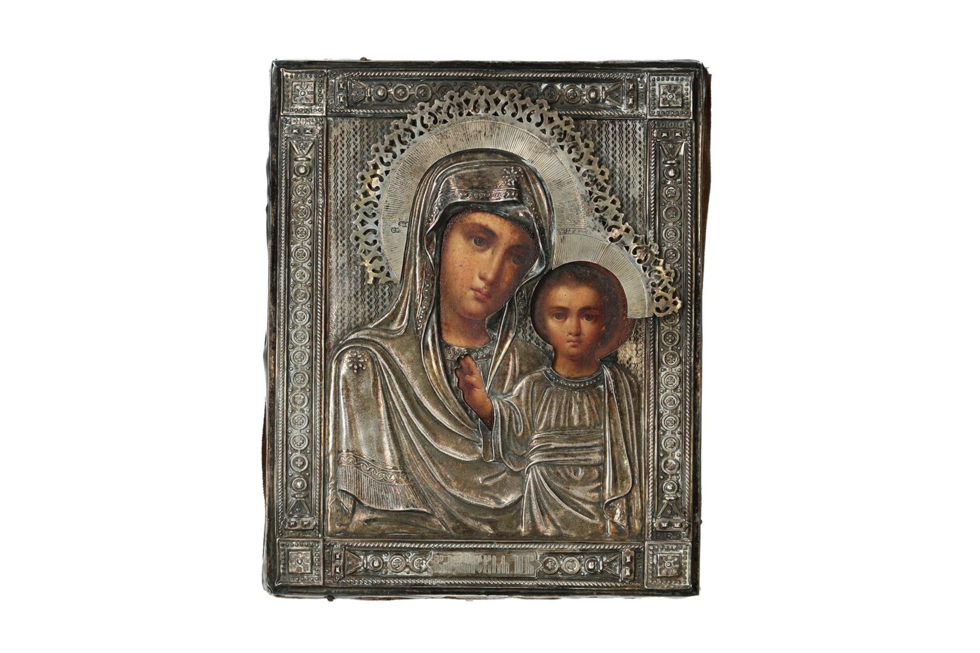 A wooden icon with silver riza, depicting 'Mary with child'. Russia, around 1900. H. 18 cm. W. 14.