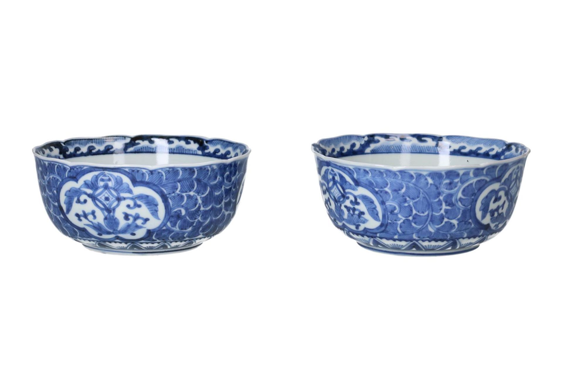 A pair of blue and white porcelain bowls, decorated with flowers. Marked with 4-character mark.