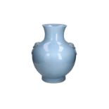 A clair de lune porcelain hu vase after archaic bronze model, with handles in the shape of