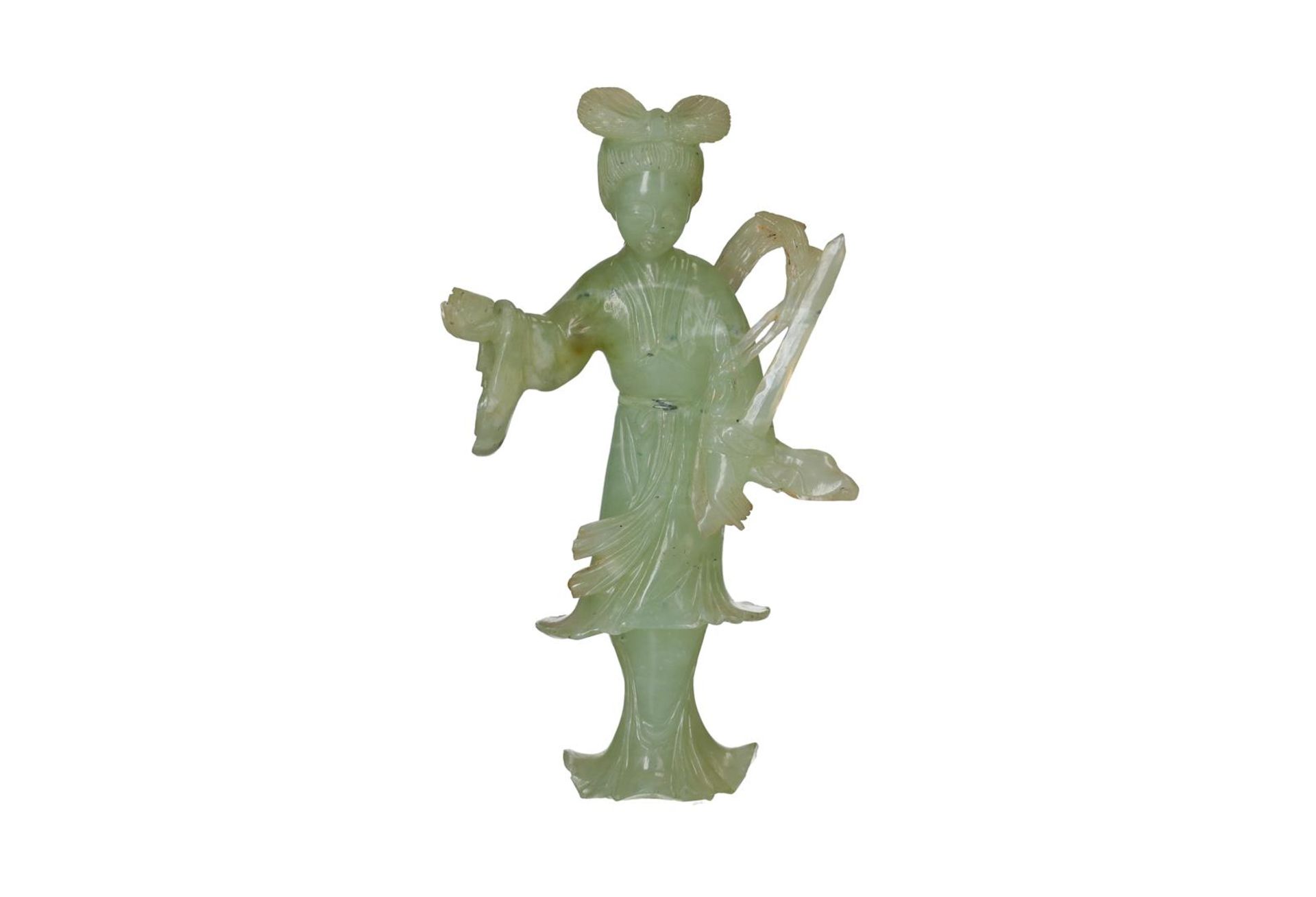 A carved jade sculpture of a woman holding valuables. China, 20th century. H. 15.5 cm. Condition