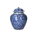 A blue and white porcelain lidded jar, decorated with flowers. The lid with scalloped rim. Unmarked.