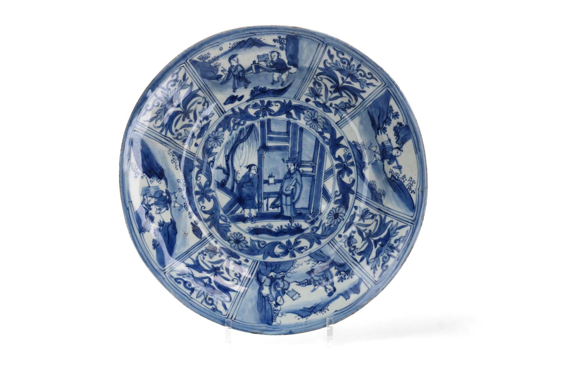 A blue and white porcelain deep dish, decorated with flowers and outdoor scenes. Unmarked. China,