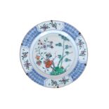 A doucai porcelain charger, decorated with bamboo, flowers and fruits. Unmarked. China, Qianlong.