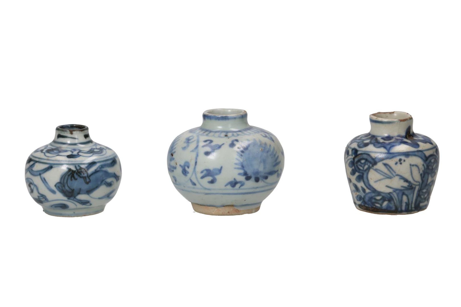 Lot of three blue and white porcelain vases, decorated with deer, horses and peaches. Unmarked.