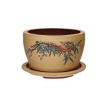 A duanni Yixing cachepot with dish, decorated with characters and flower branches. Signed and