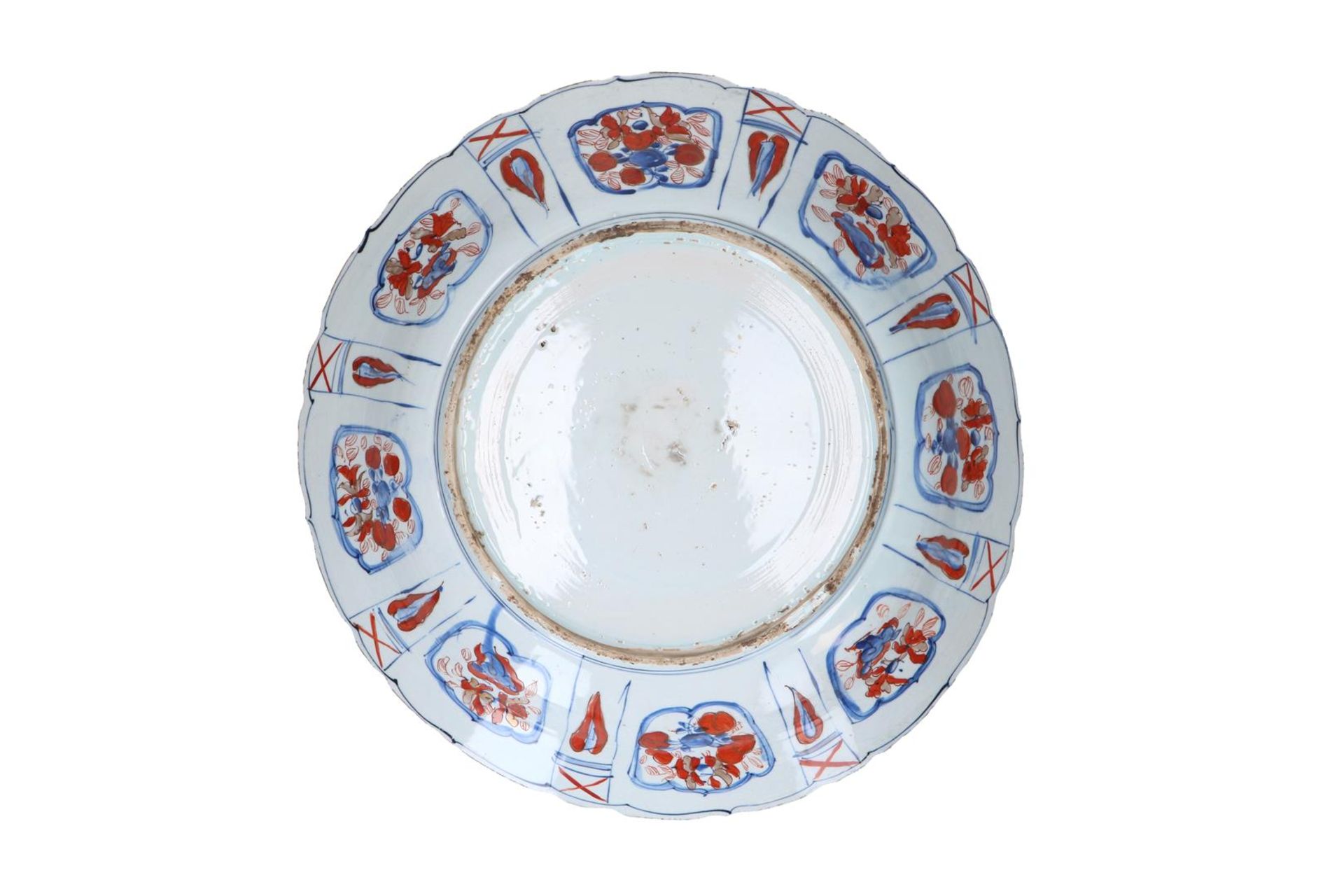 A blue and overglaze red porcelain deep charger with scalloped rim, decorated with flowers, fruits - Image 2 of 3