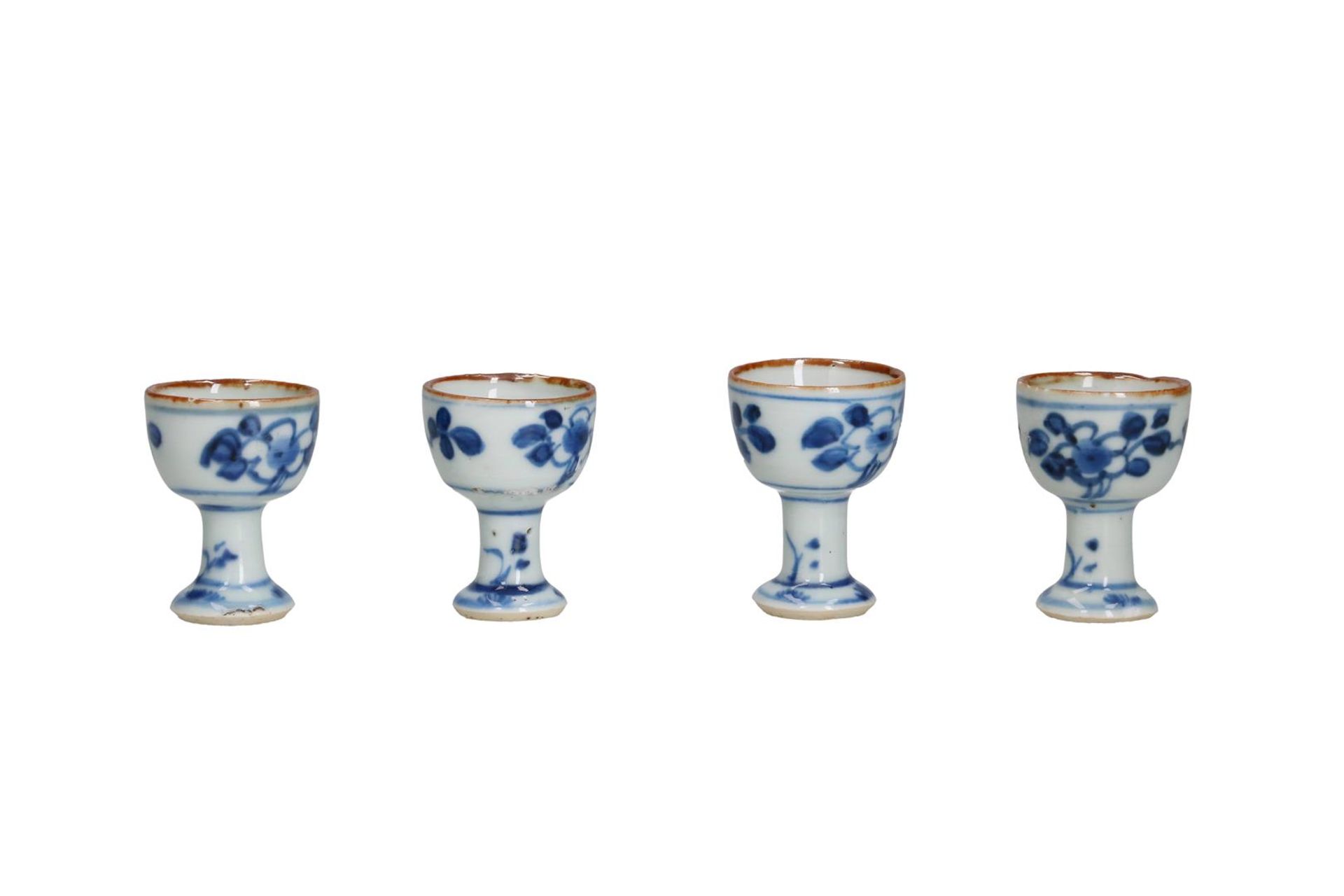 Four blue and white porcelain stemcups with a floral decoration. Unmarked. China, Kangxi. H. 4.5 cm. - Image 2 of 10