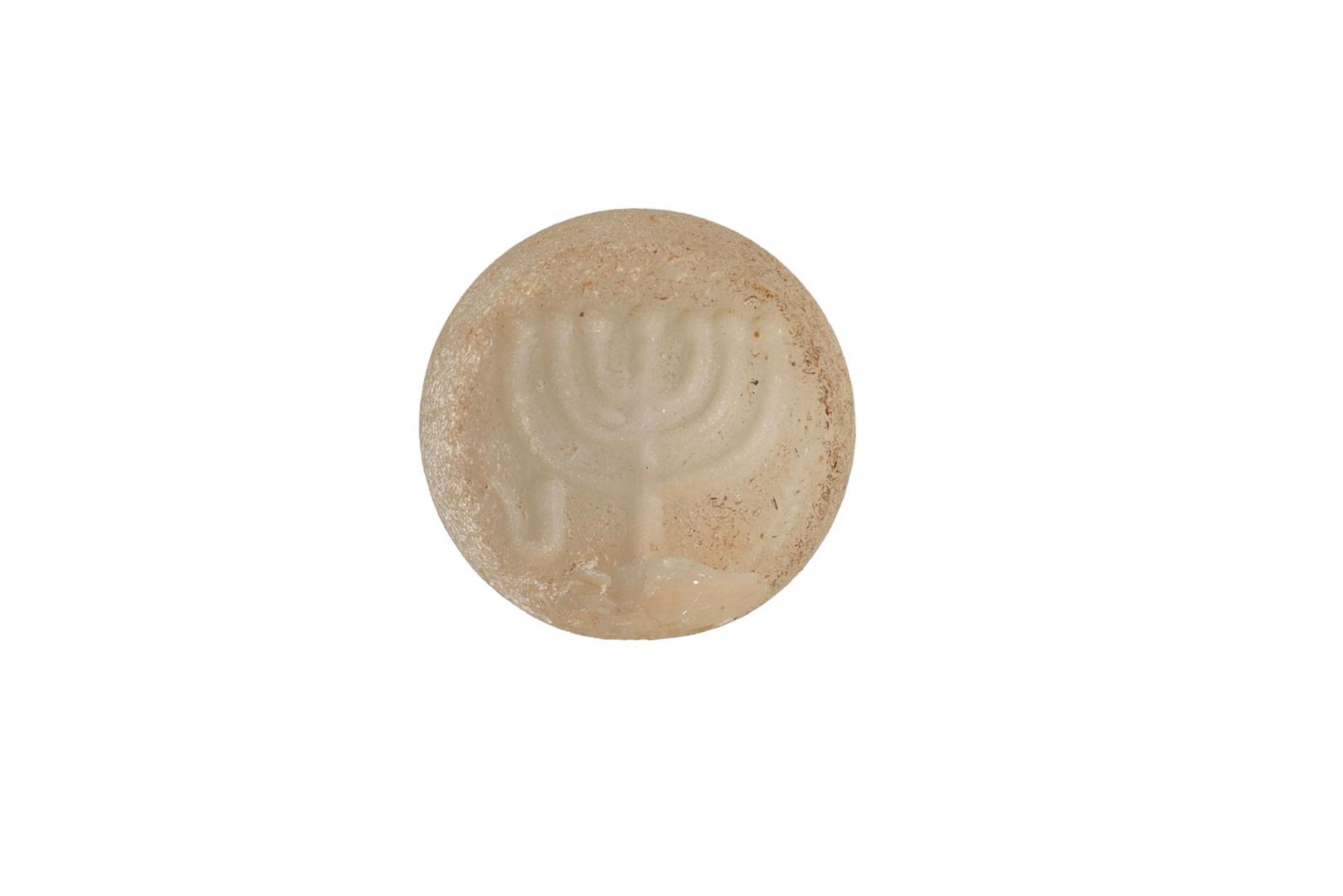 A Medieval Jewish rock crystal seal with a menorah. ca. 7th/8th century. Diam. 1.5 cm.Provenance: