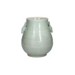 A celadon glazed porcelain zun vase with two handles in the shape of deer heads, decorated with