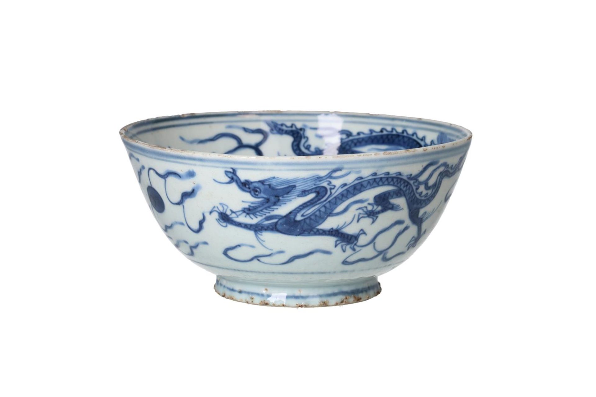 A blue and white porcelain bowl, decorated with dragons chasing a flaming pearl. Unmarked. China,