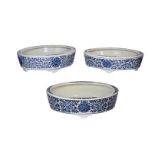 Lot of three blue and white porcelain jardinieres, decorated with flowers. All marked with seal mark