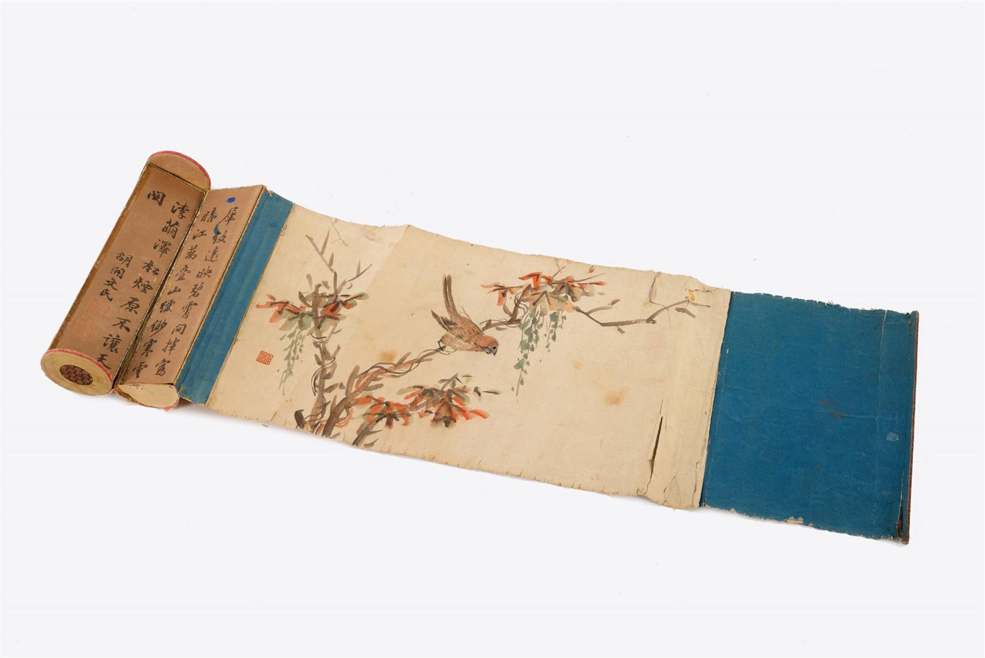 A scroll depicting a bird on a branch, unrolling the scroll it reveals a stamp case with colored ink
