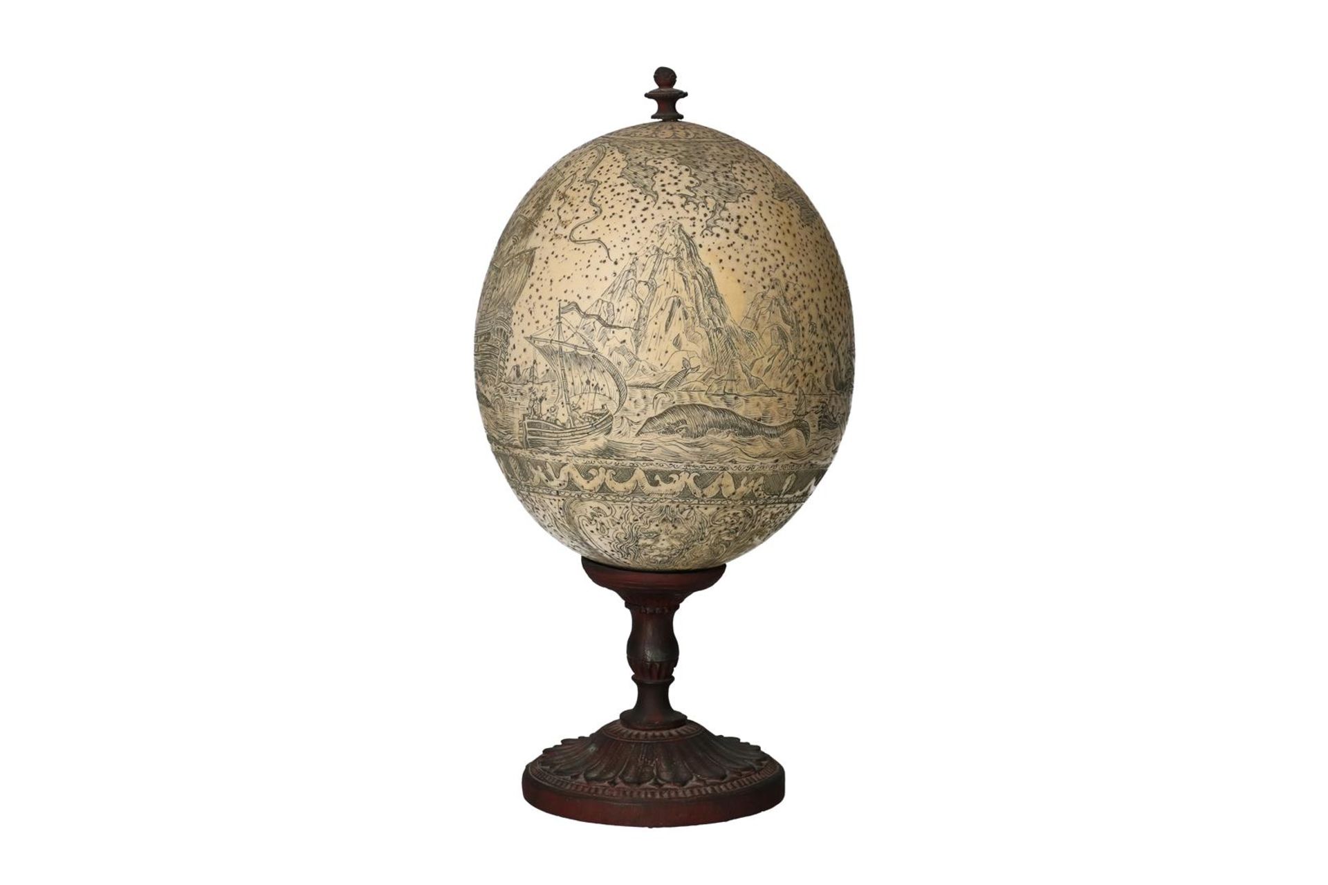 A carved ostrich egg on metal base, depicting the whale hunt. 19th century. H. 22.5 cm. Condition