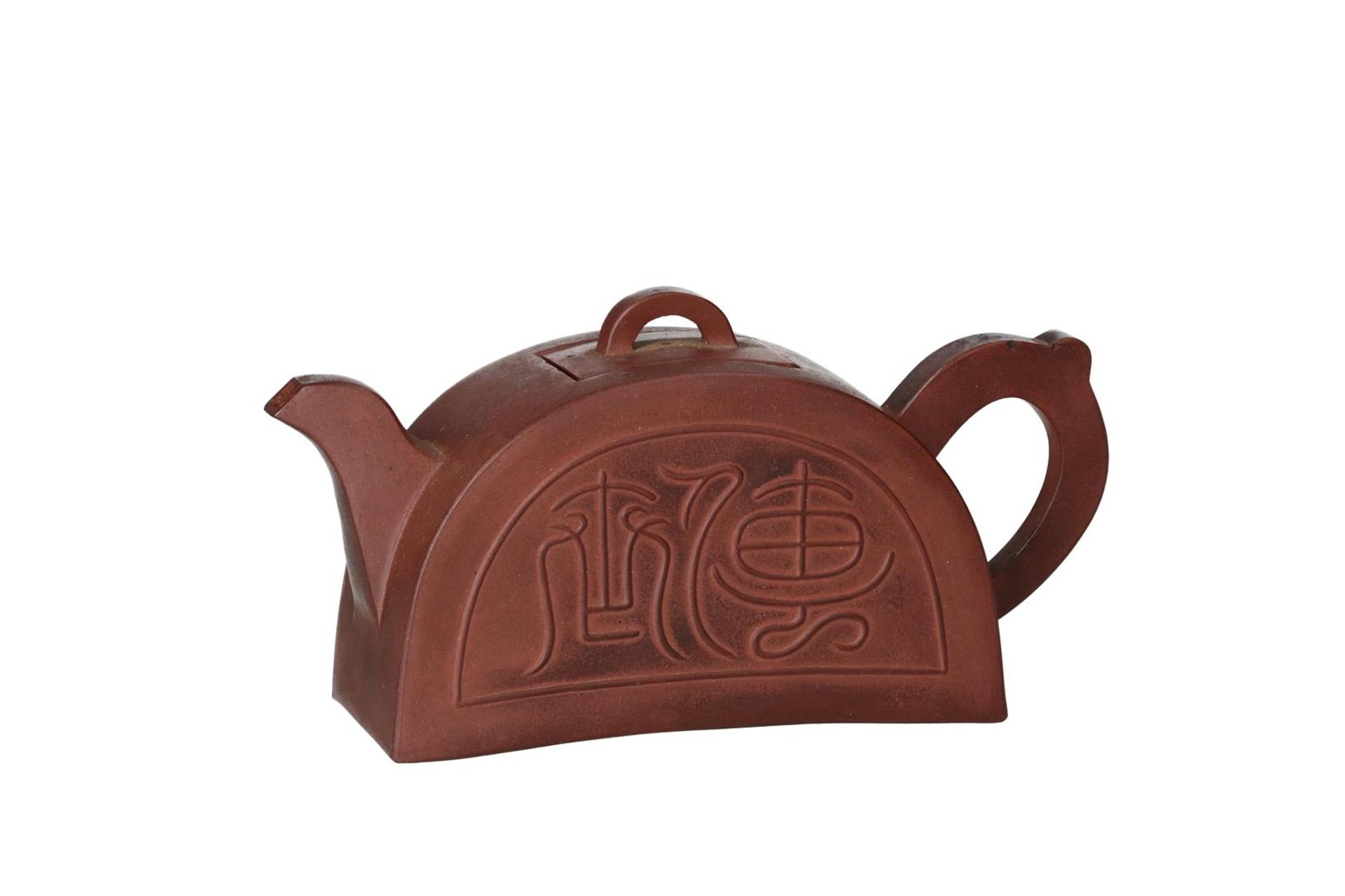 A Yixing roof tile-shaped teapot, decorated with archaic script. Marked with seal mark in cover,