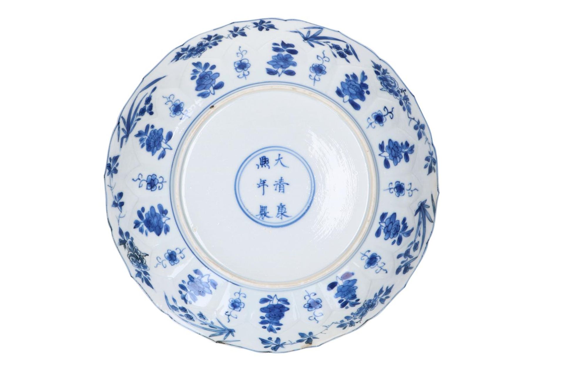 A blue and white porcelain dish with scalloped rim, decorated with ladies in a garden and flowers. - Image 4 of 5