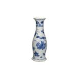 A blue and white porcelain wall vase with a floral decor. Unmarked. China, Transition. H. 23.5 cm.