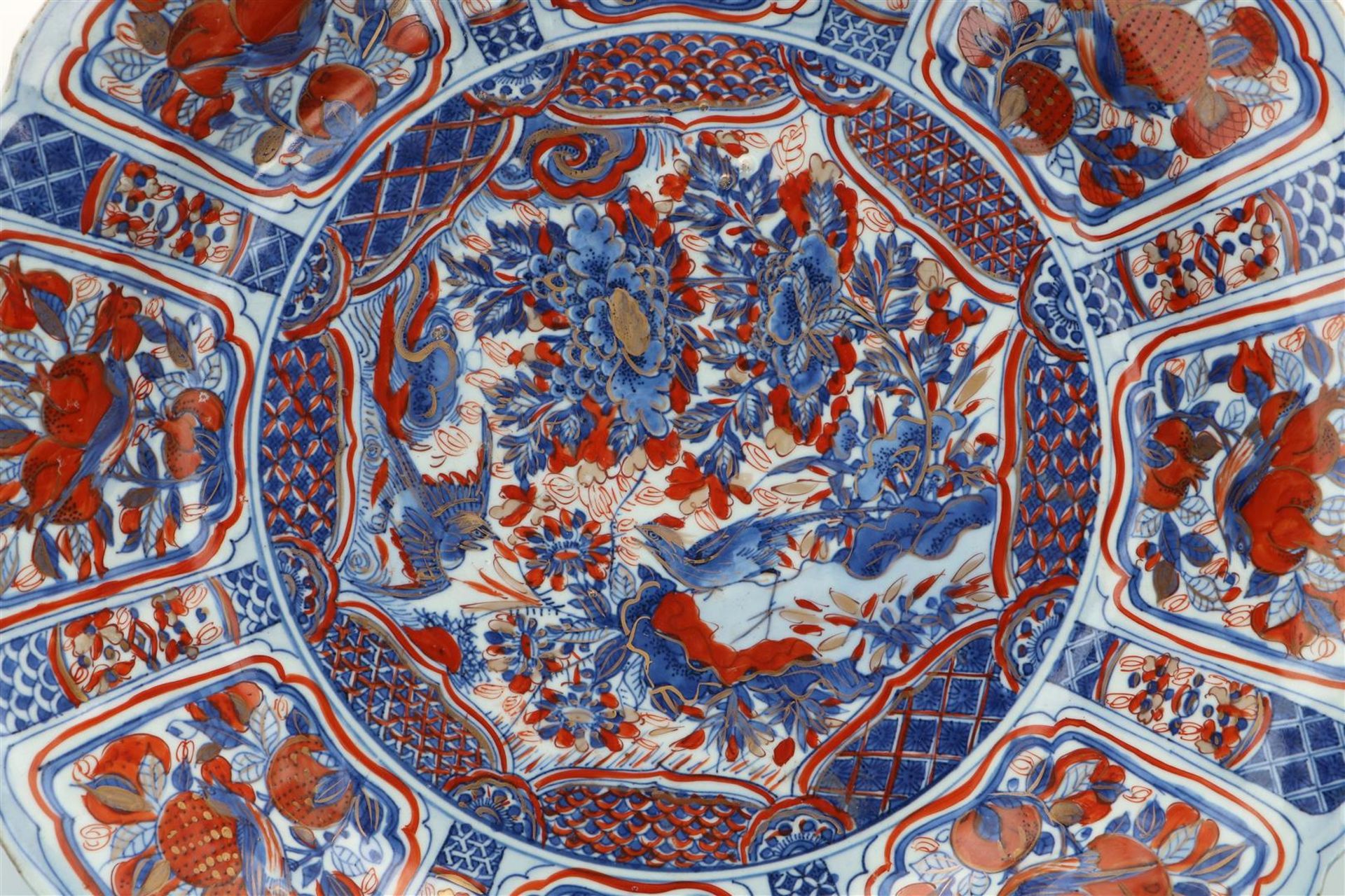 A blue and overglaze red porcelain deep charger with scalloped rim, decorated with flowers, fruits - Image 3 of 3