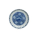 A blue and white 'kraak' porcelain dish with a scalloped rim, decorated with a flying horse and