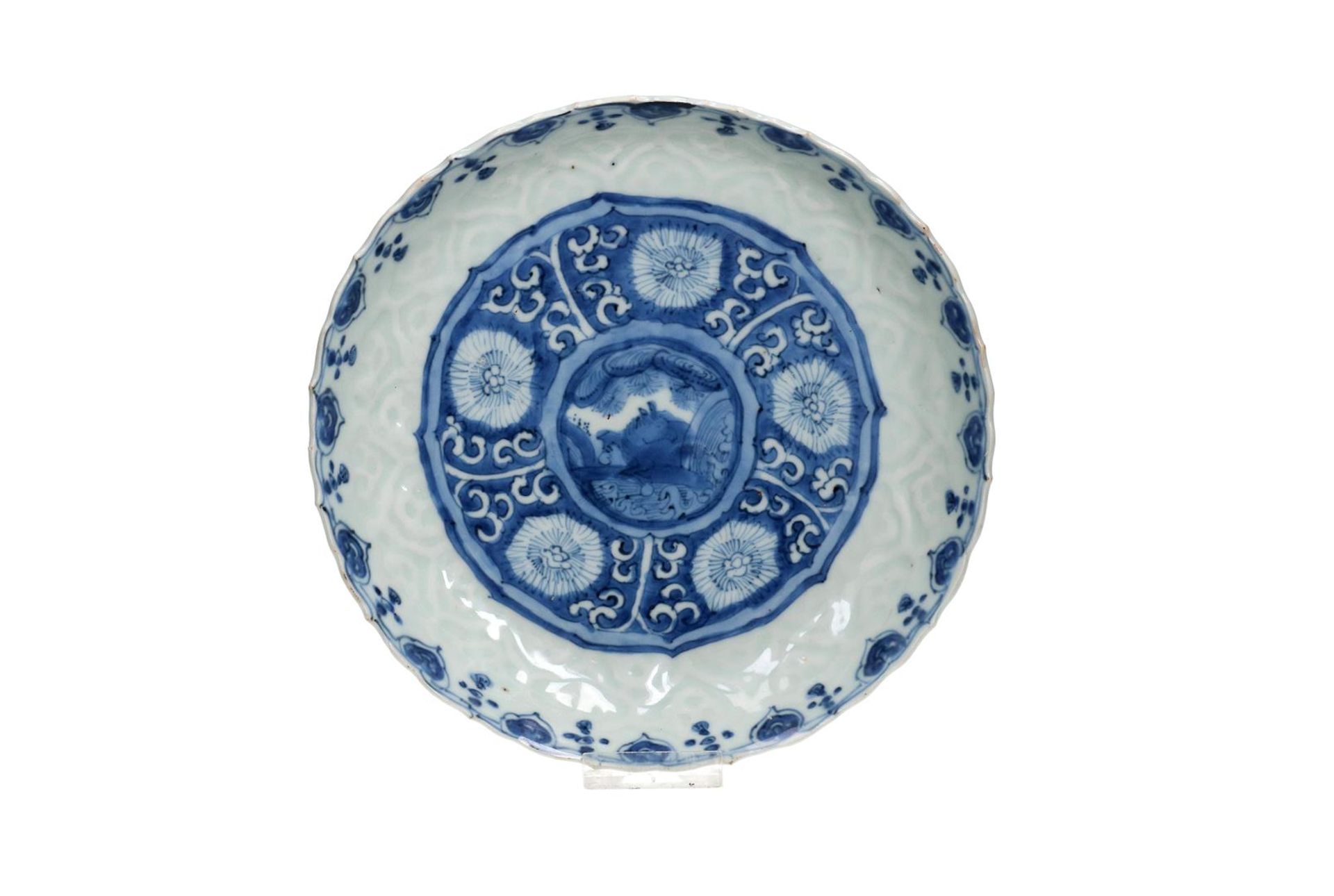 A blue and white 'kraak' porcelain dish with a scalloped rim, decorated with a flying horse and