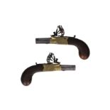 A pair of very small flintlock muff pistols with boxlocks. Brass frames engraved and with makers