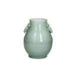 A celadon glazed porcelain zun vase with two handles in the shape of deer heads, decorated with