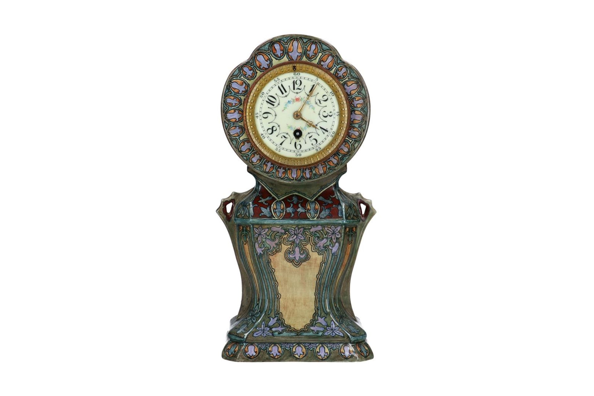 A polychrome ceramic mantel clock, decorated with flowers. Marked. Holland, Utrecht, around 1910. H.