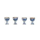Four blue and white porcelain stemcups with a floral decoration. Unmarked. China, Kangxi. H. 4.5 cm.