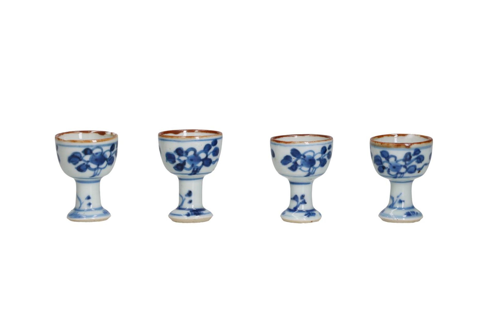Four blue and white porcelain stemcups with a floral decoration. Unmarked. China, Kangxi. H. 4.5 cm.