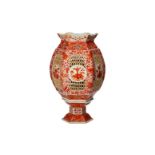 An iron red porcelain lantern with a floral decor, on loose base. Unmarked. China, 20th century.