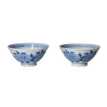 A pair of blue and white porcelain bowls, decorated with flowers and a butterfly. Unmarked. China,