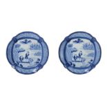 A pair of blue and white Arita porcelain dishes with scalloped rim, decorated with two fishermen