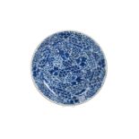 A blue and white porcelain charger with a floral decoration. Unmarked. China, Kangxi. Diam. 36 cm.