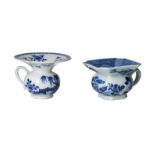 Lot of two blue and white porcelain spittoons, decorated with flowers and gardens. Unmarked.