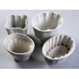 A COLLECTION OF FOUR VICTORIAN PORCELAIN JELLY MOULDS