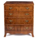 A WALNUT BOWFRONTED CHEST-OF-DRAWERS