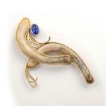 A TANZANITE, DIAMOND AND BONE BROOCH