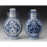 A NEAR PAIR OF CHINESE BLUE AND WHITE "DRAGON" MOONFLASKS, BIANHU, QING DYNASTY, 19TH CENTURY