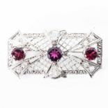 A RHODOLITE AND DIAMOND BROOCH