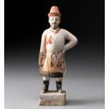 A CHINESE POTTERY FIGURE OF AN ATTENDANT, MING DYNASTY, 1368 - 1644