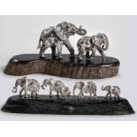 A GROUP OF CAST SILVER ELEPHANTS, PATRICK MAVROS