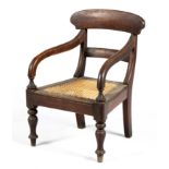 A CAPE STINKWOOD REGENCY STYLE CHILD'S ARMCHAIR, MANUFACTURED BY PIERRE CRONJE