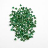 A MELEE OF UNMOUNTED ROUND MIXED-CUT EMERALDS
