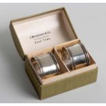 A CASED PAIR OF GEORGE IV SILVER NAPKIN RINGS, WILLIAM SUCKLING LTD, BIRMINGHAM, 1925