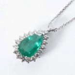 AN EMERALD AND DIAMOND PENDANT