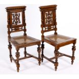 A PAIR OF WALNUT HALL CHAIRS