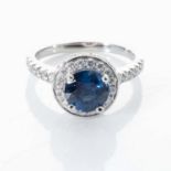 A SAPPHIRE AND DIAMOND RING